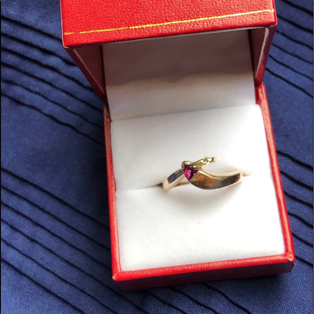 gold garnet ring with small diamond accent
